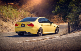 Yellow BMW on the road