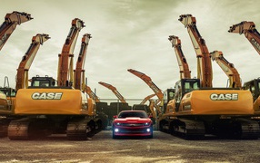 Chevrolet Camaro между экскаваторами
