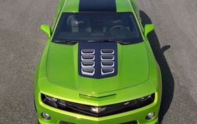 Powerful green Chevrolet Camaro on the road