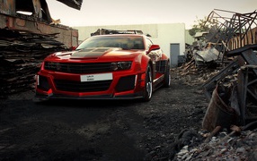 Red Chevrolet Camaro among the ruins
