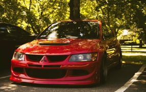 Красный Mitsubishi Lancer Evolution IX