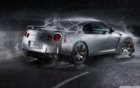 Silver Nissan GT-R in the rain