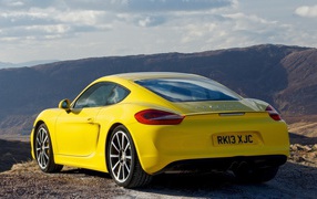 Beautiful yellow Porsche in the mountains