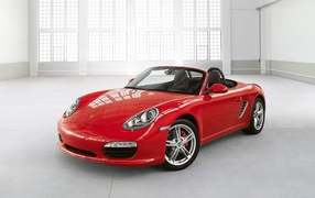 Red Porsche in a white room