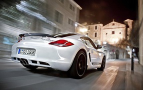 White Porsche Boxter on a city street