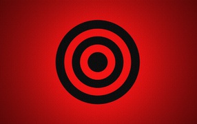 Черная мишень на красном фоне