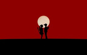 Мальчик и девочка на красном фоне