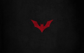 Красная летучая мышь на черном фоне