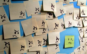 Испуганный стикер в окружении злых стикеров