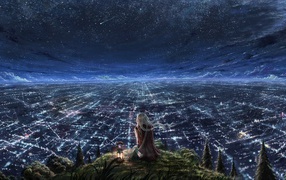The girl looks at the endless city