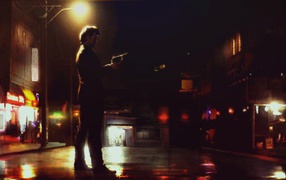 Мужчина с пистолетом на ночной улице