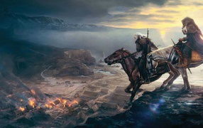 Всадники смотрят на горящую деревню