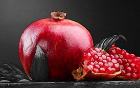 Juicy pomegranate on a black background