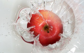 Red apple in clear water