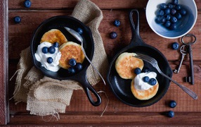 Pancakes with cream and blueberries