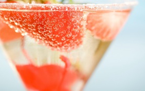 Cocktail with strawberry pieces
