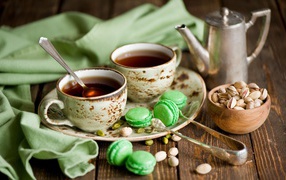 Tea with cookies and green pistachios