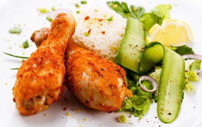 Chicken legs with rice and vegetables