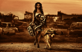 Женщина с собакой на фоне руин