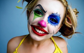 Clown makeup on the face of the girl Lexi Belle