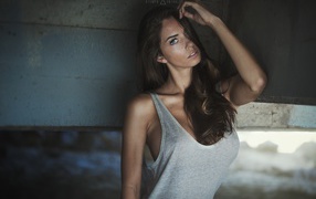 The dark-haired girl in a gray t-shirt