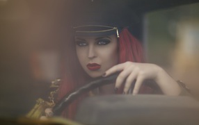 The girl in a cap and driving
