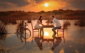 Romantic dinner on a flooded field