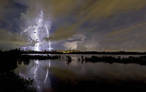 Thunderstorm lightning reflected in the lake