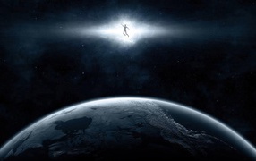 Человек в луче над планетой