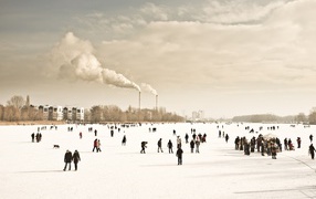 People walk on frozen river
