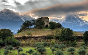Castle on a hill in the mountains, HDR Photo