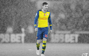 Игрок Арсенала во время дождя, футбол