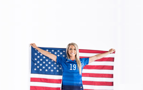 Girl athlete Julie Johnston with US flag