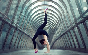 Gymnast doing exercise in gallery