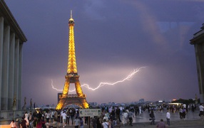 Lightning in the sky behind the Eiffel Tower