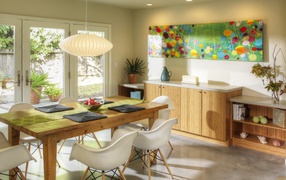 The wooden dining table in bright kitchen