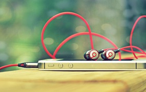 iPhone with headphones Beats