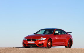 Красный немецкий автомобиль JM Car Design BMW M4, 2017