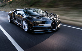 Black fast car Bugatti Chiron on the track