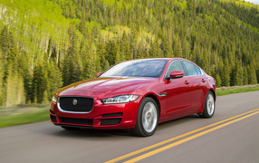 Red car Jaguar XE on the road