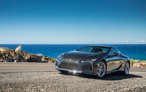 Brilliant silver Lexus LC 500 on the background of the ocean