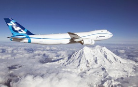 Boeing 747 over the snow-capped mountains
