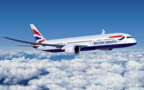 The Boeing 777 of British Airways flying above the clouds
