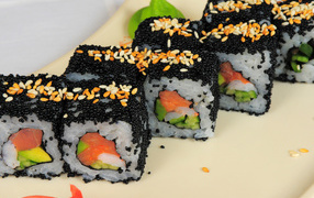 Delicious rolls with black caviar and red fish