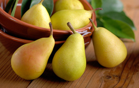 Ripe juicy yellow pears on the table