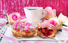 Appetizing donuts with cherries on the table with coffee
