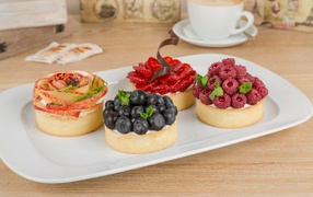 Appetizing cakes with berries for dessert