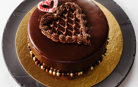 Cake with black chocolate and cream