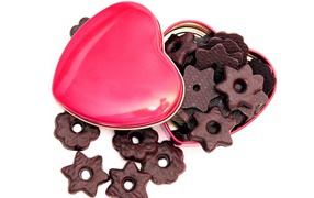 Chocolate cookies in a pink box in the shape of a heart