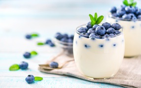 Dessert with yoghurt and blueberries with glass glasses